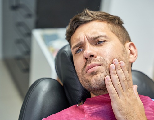 Man at the dentist with a toothache